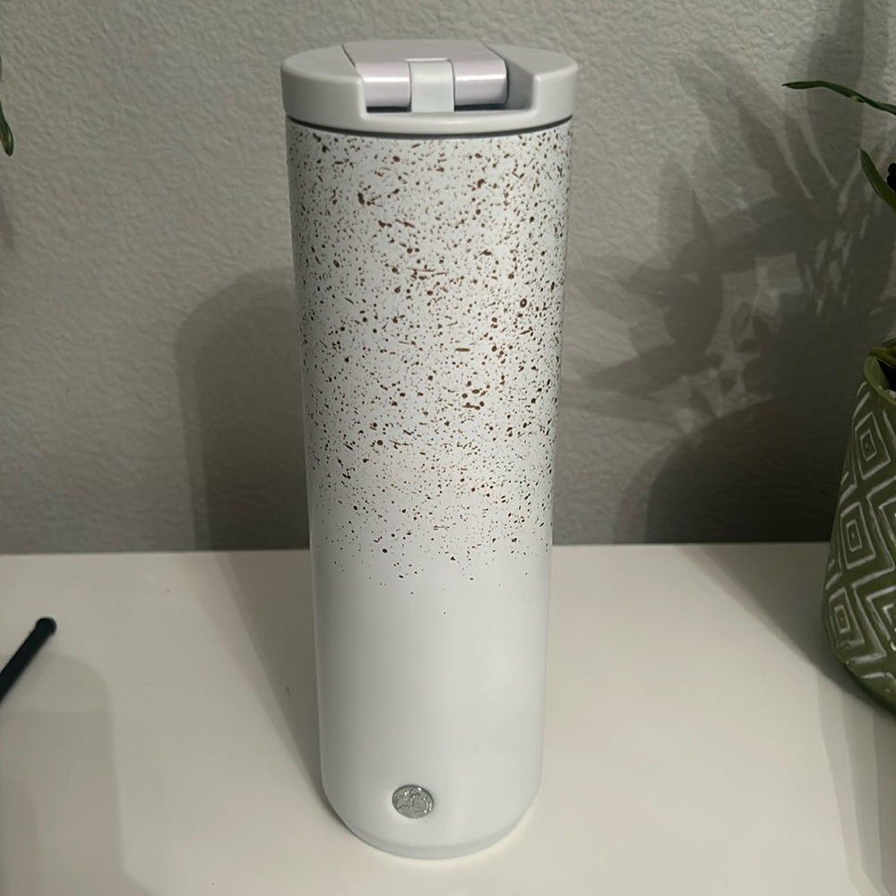 White and gold speckled Starbucks cup